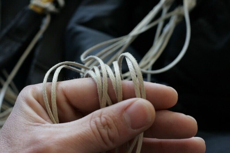 Close-up of Brian Germain's hand holding a tangle of fine lines
